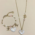Chanel Pearl Heart Necklace Bracelet Earrings